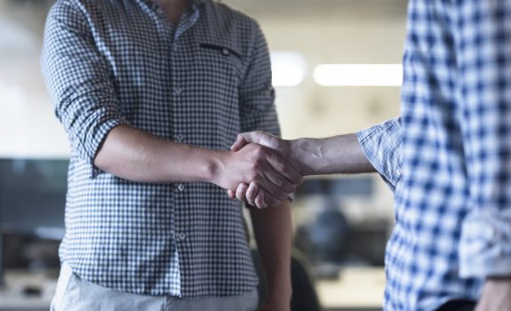 start up business people  handshake on team meeting  at modern business office interior